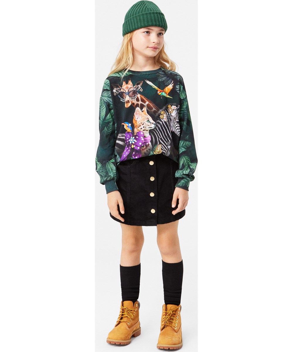 Karli - Ponderosa Pine - Mörkgrön ribbad mössa med uppvik och Molos logga på framsidan.