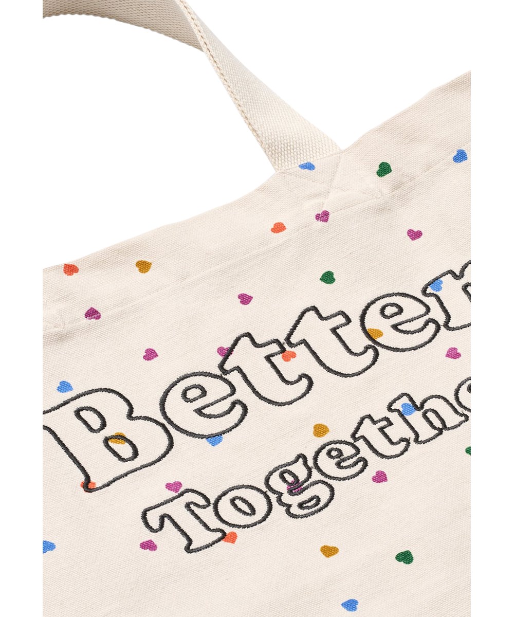 Urd Bag - Confetti_Rainbow - Beige tygväska för barn gjord av ekologisk bomull med ett hjärtmönster