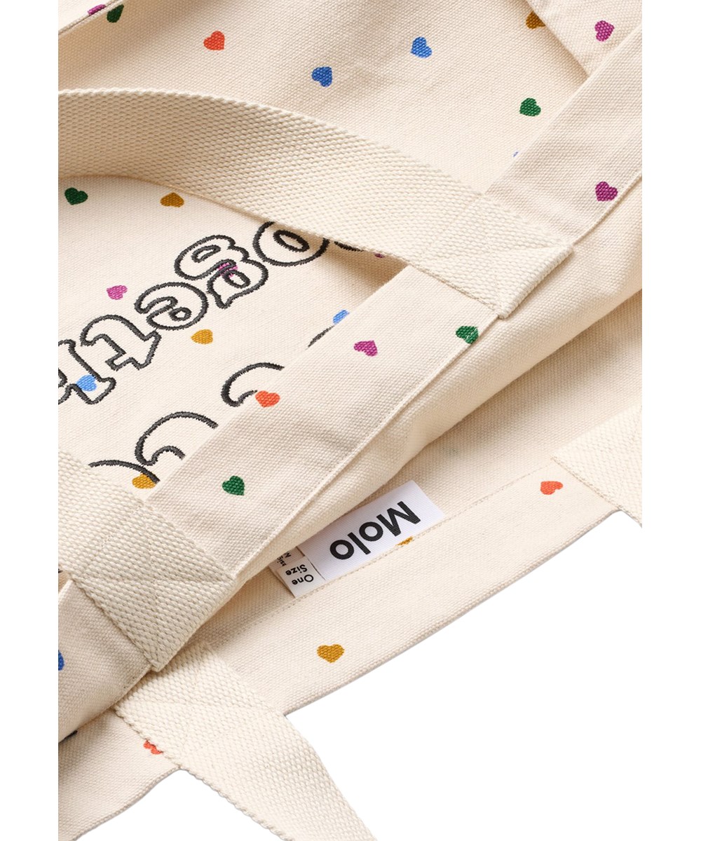 Urd Bag - Confetti_Rainbow - Beige tygväska för barn gjord av ekologisk bomull med ett hjärtmönster