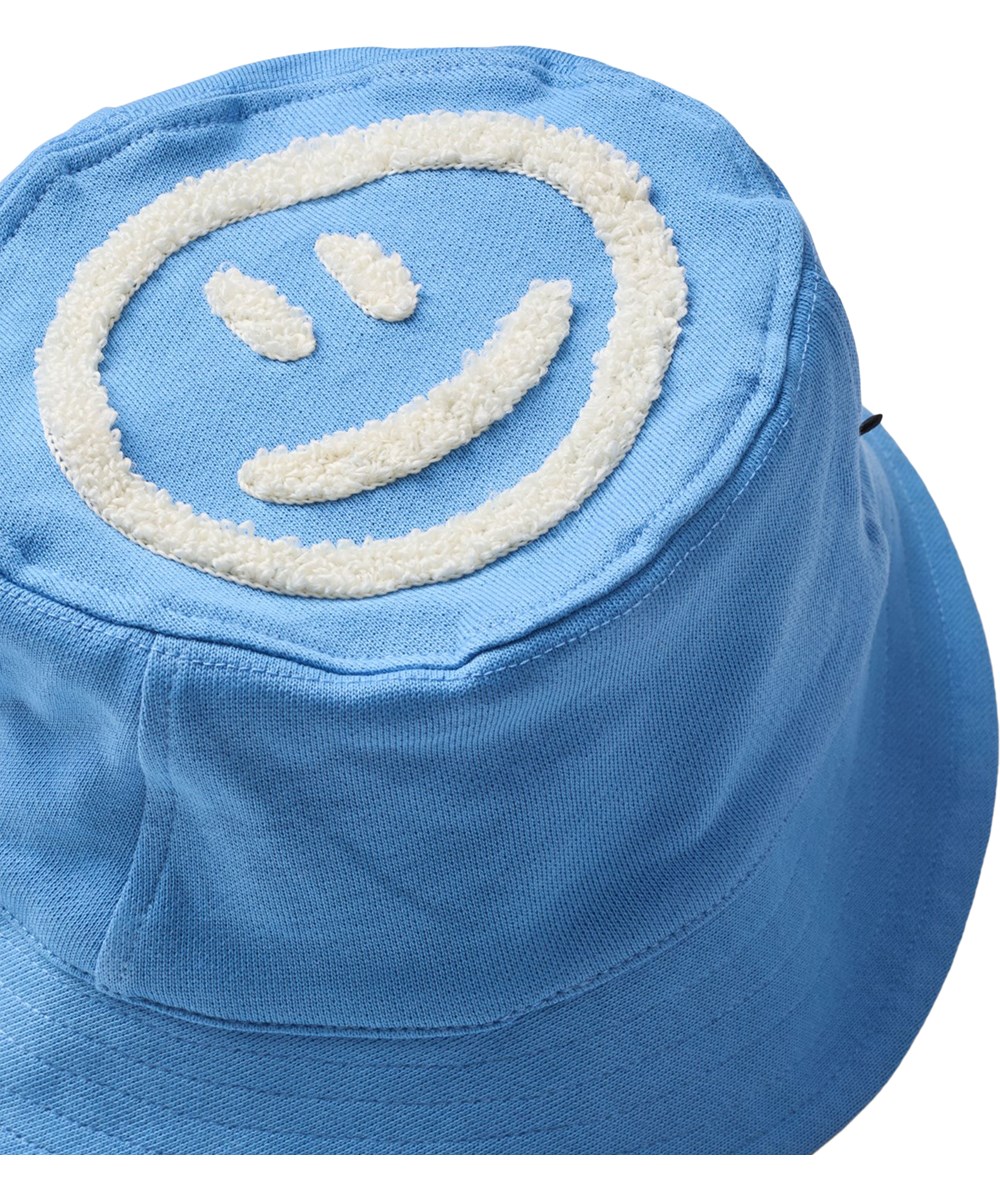 Nomly - Blue Tide - Blauwe zonnehoed voor kinderen gemaakt van biologisch katoen met leuk artwork