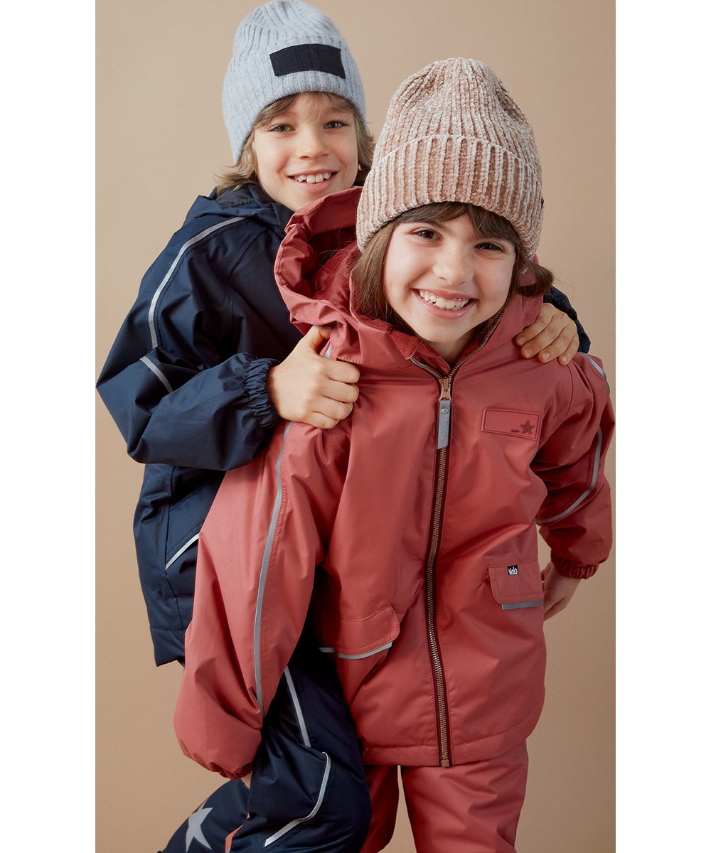 Karli - Warm Grey Melange - Gebreide kabelmuts in grijze wol