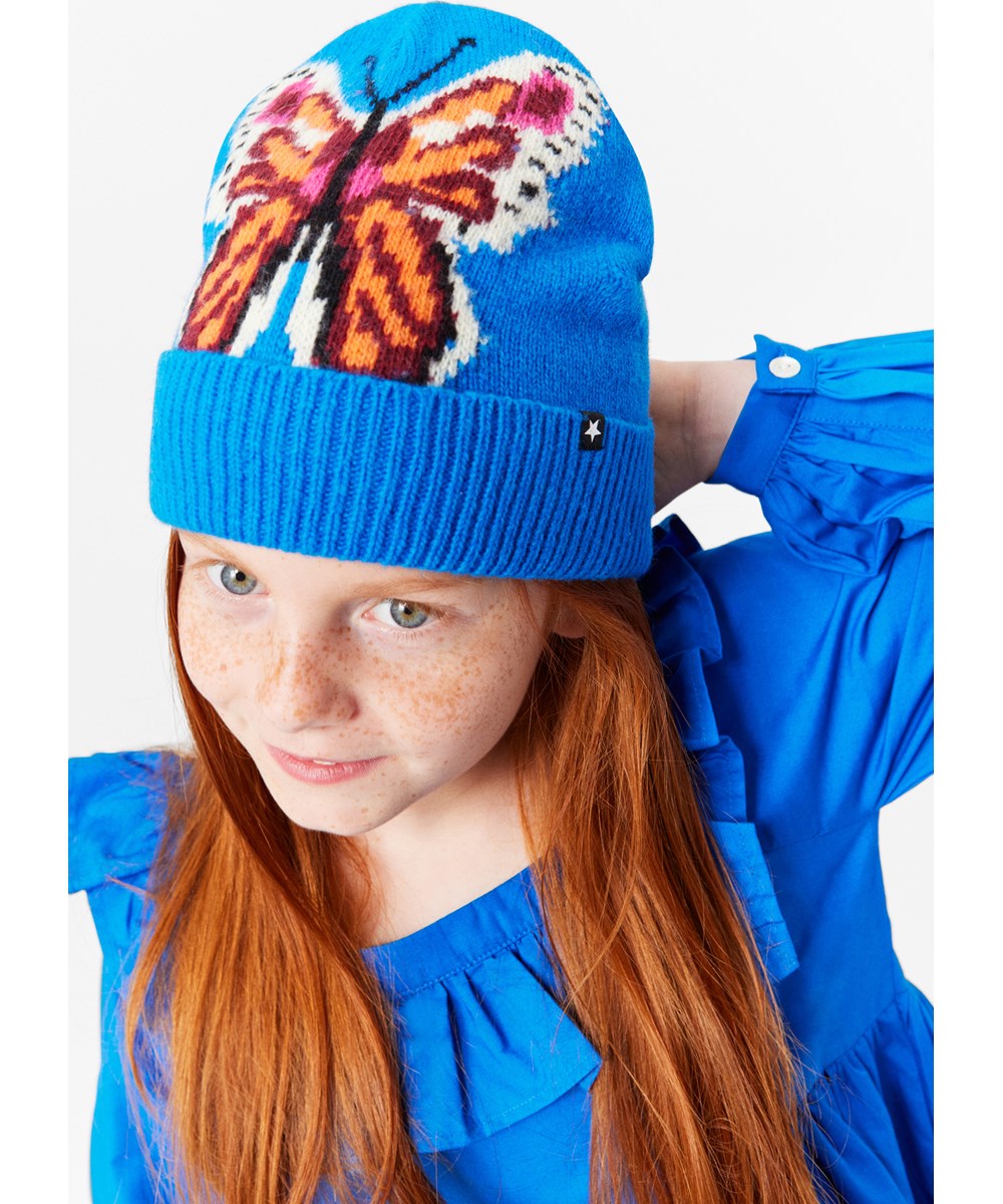 Kipp - Butterfly Knit - Blauwe gebreide muts voor kinderen van een zachte wolmix.
