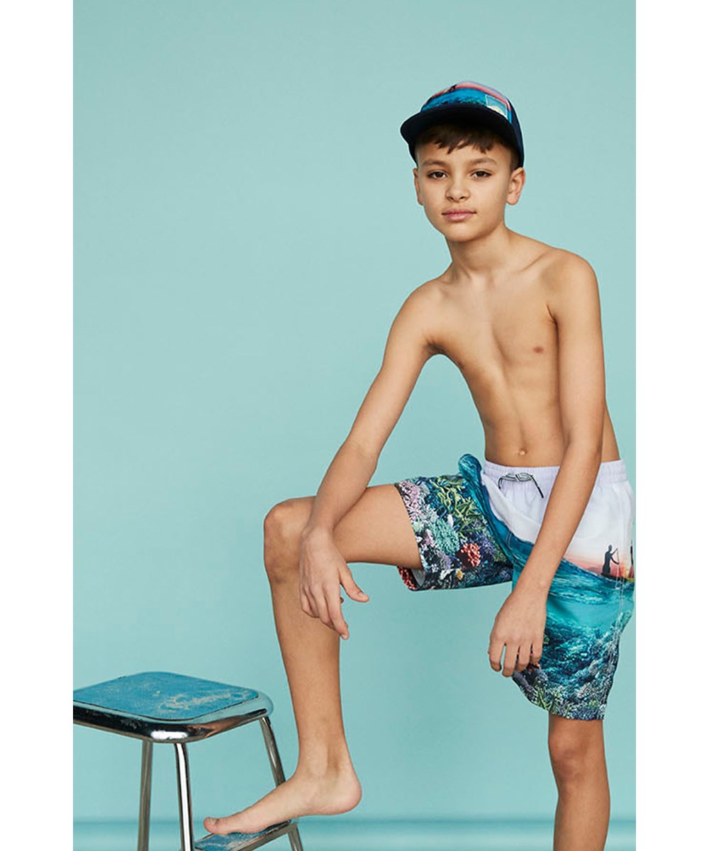 Big Shadow - Ocean Explore - Donkerblauwe pet met een paddle board print