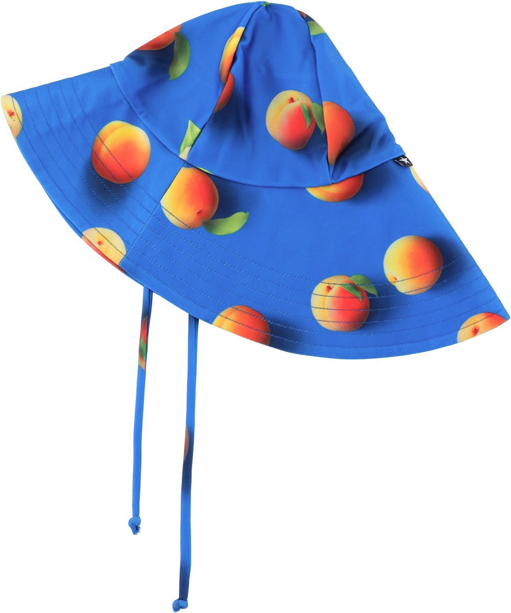 Nuka - Apricot - Blauwe baby zonnehoed met een oranje abrikozenprint