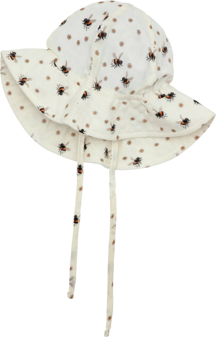 Noel - Bumblebee - Sun hat in lightweight, organic cotton weave with wavy brim and chin ties. The hat is in an all over print of small flowers with humming bumble bees flying around. 