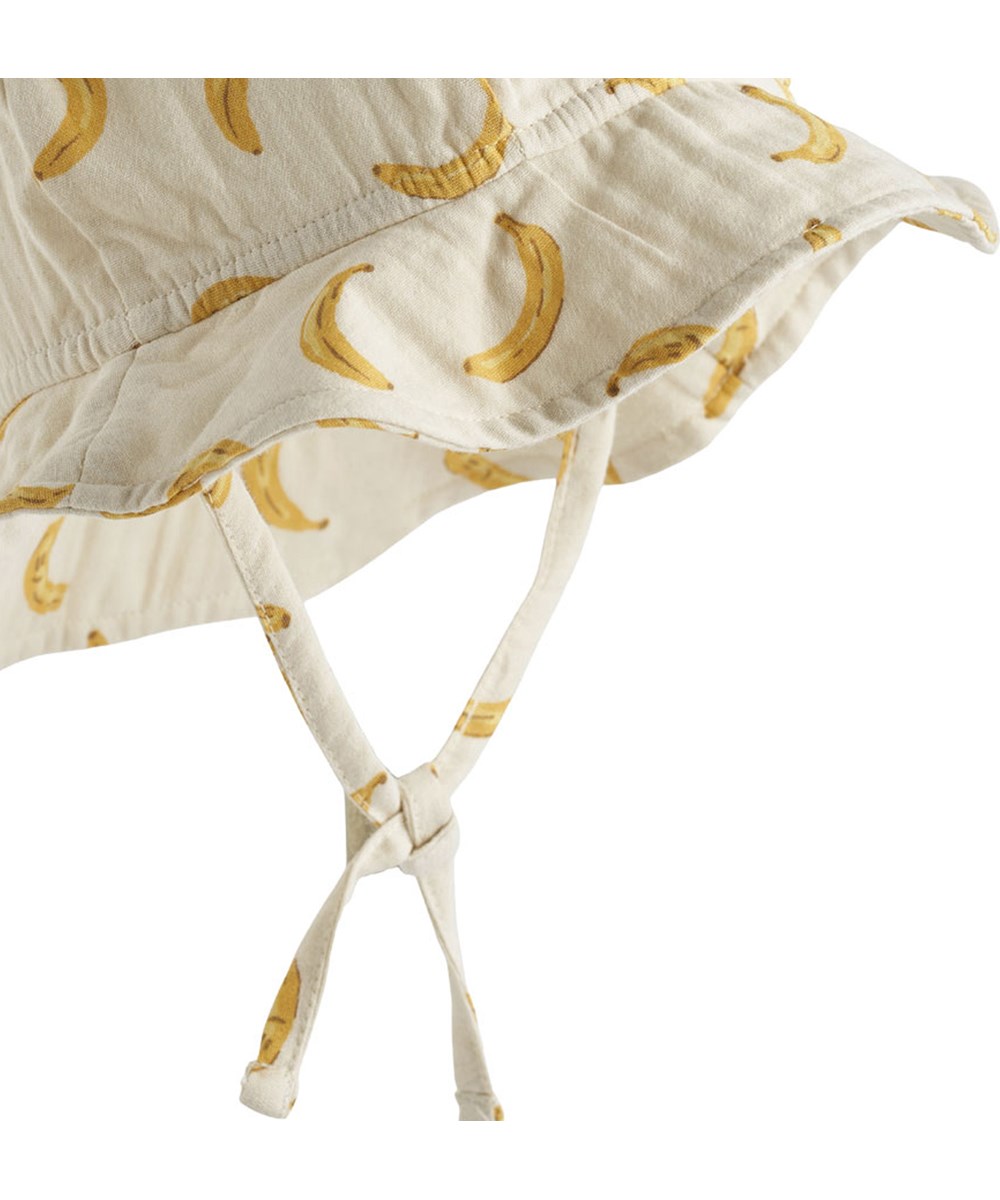 Noel - Cute Bananas - Baby hat with brim in organic cotton and banana print.