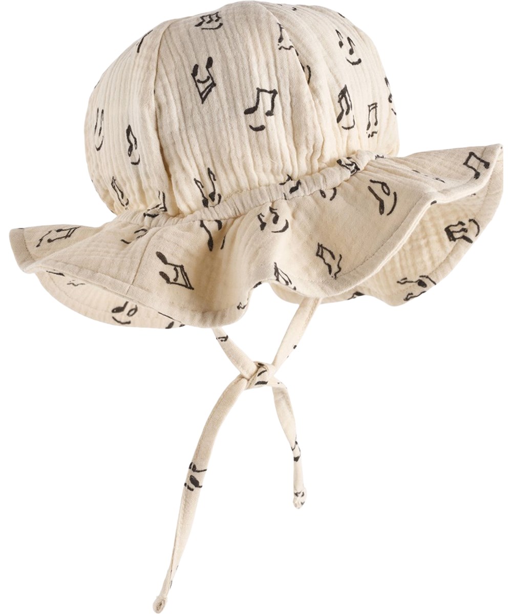 Noel - Happy Notes - Cream-coloured sun hat for the little ones made of organic cotton muslin with a brim and music print