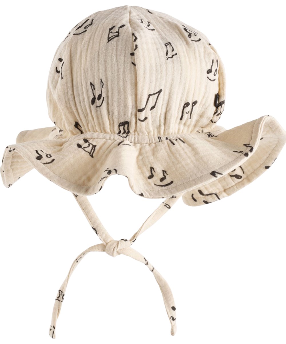 Noel - Happy Notes - Cream-coloured sun hat for the little ones made of organic cotton muslin with a brim and music print