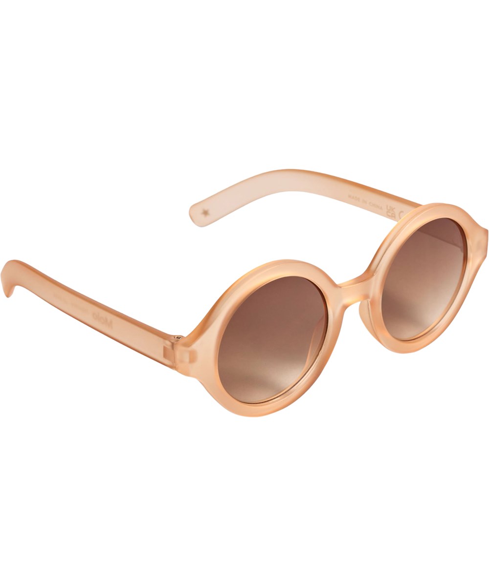 Shelby - Peach Fuzz - Round, orange sunglasses for children with UV protection.