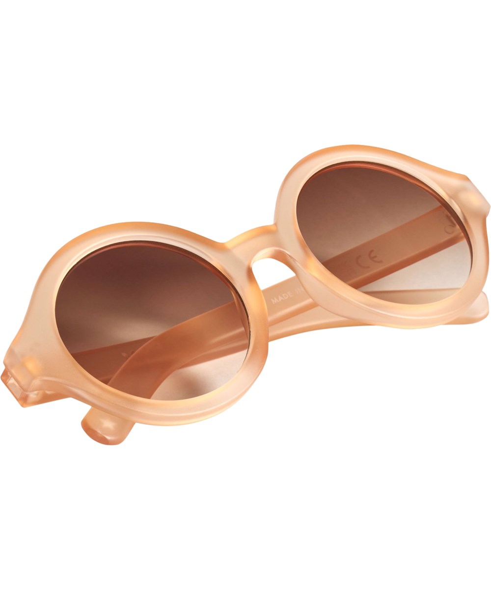 Shelby - Peach Fuzz - Round, orange sunglasses for children with UV protection.