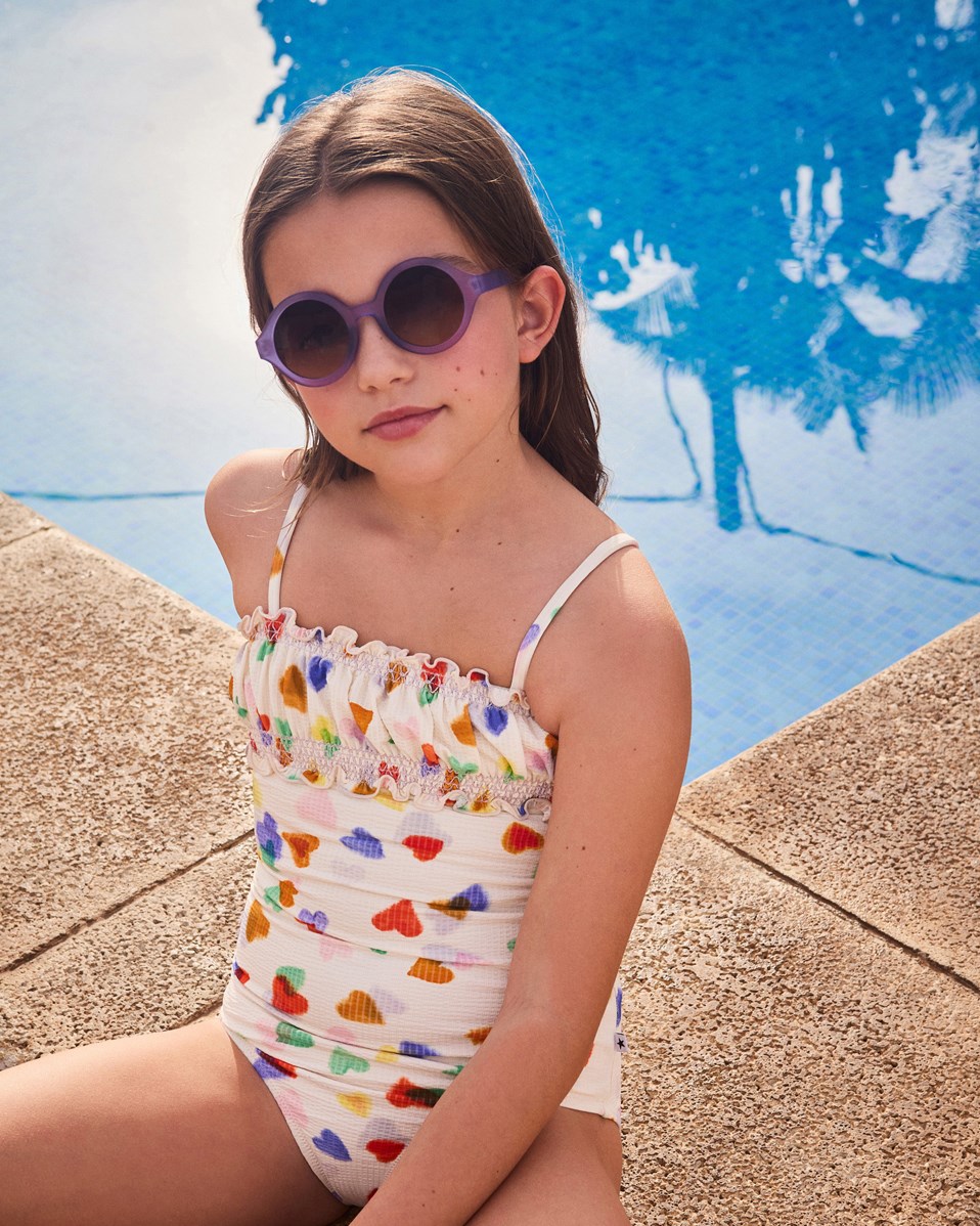 Shelby - Purple Glo - Round children's sunglasses in purple with tinted lenses, satin finish, and 100% UV protection.