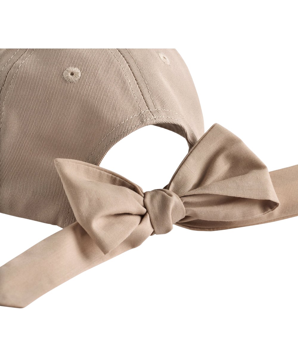 Stewie - Soft Powder - Cream-coloured cap for children with bow detail 