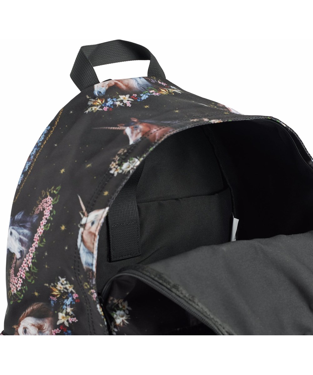 Backpack Mio - Magical Galaxies - Black backpack for children with a unicorn and flower print.