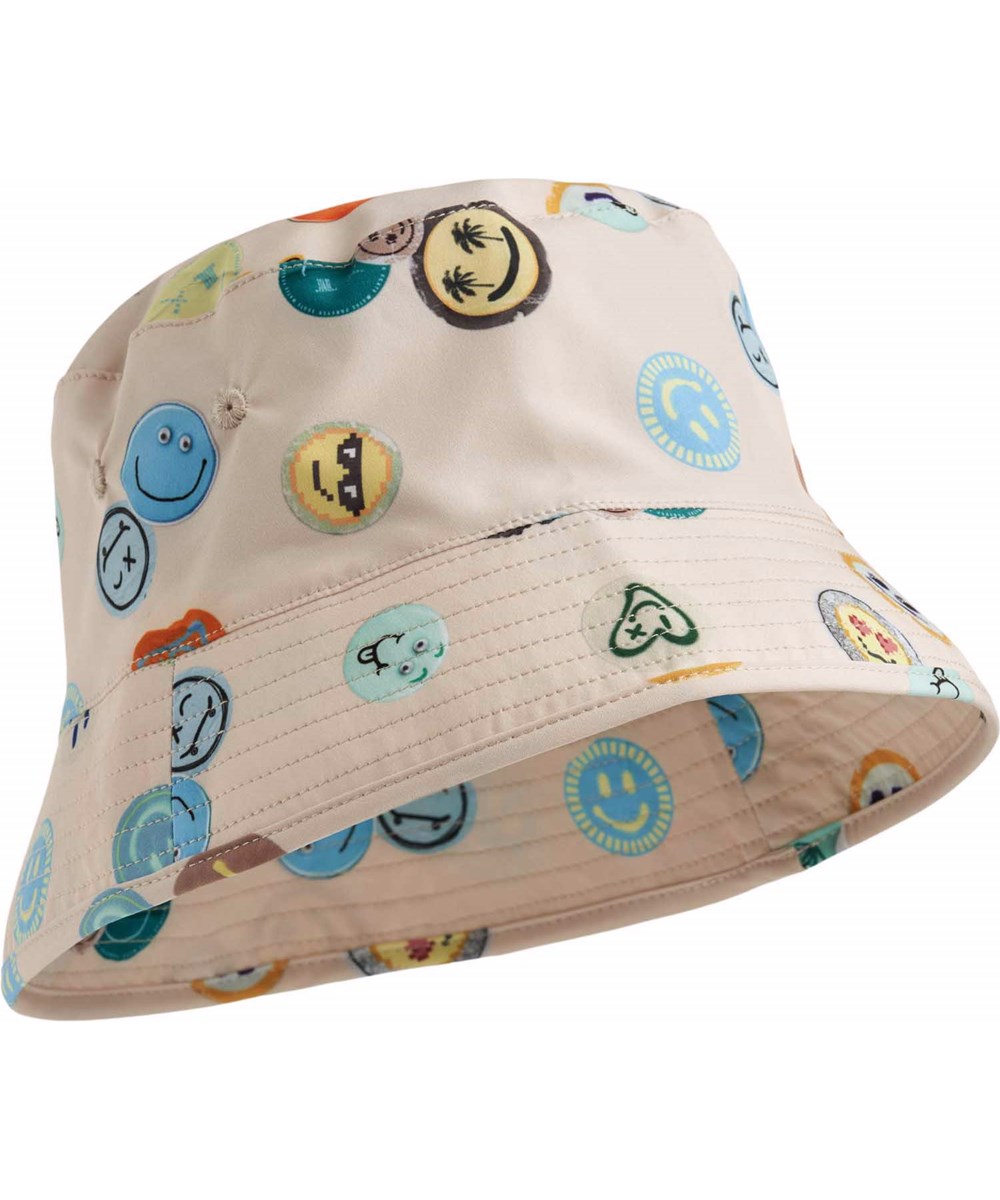 Niks - Sand Smile - Beige bucket hat with smiling faces for children in recycled nylon with UV protection 50+.