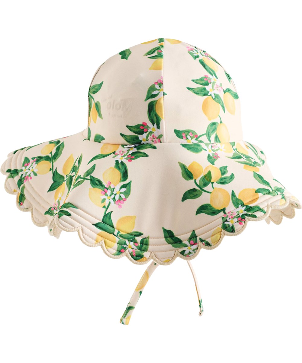 Nuka - Mini Citrus - Yellow stretchable sun hat with citrus print for children made from recycled polyester with UV protection 50+.