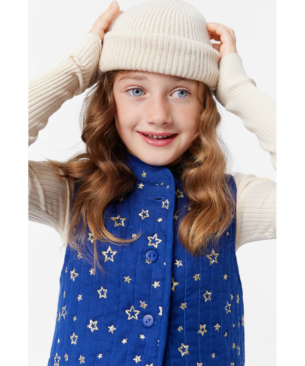 Keilo - White Noise - Off-white rib-knit woolen beanie with Molo's logo on the roll up.