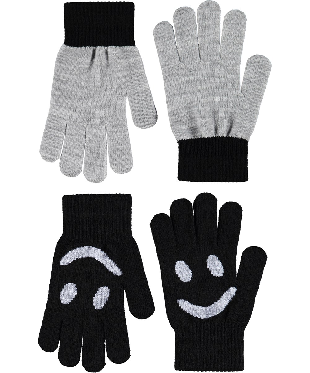 Kello - Black - 2-pack of knitted gloves for children. One pair is gray and black, while the other pair is black with a gray smiling face.