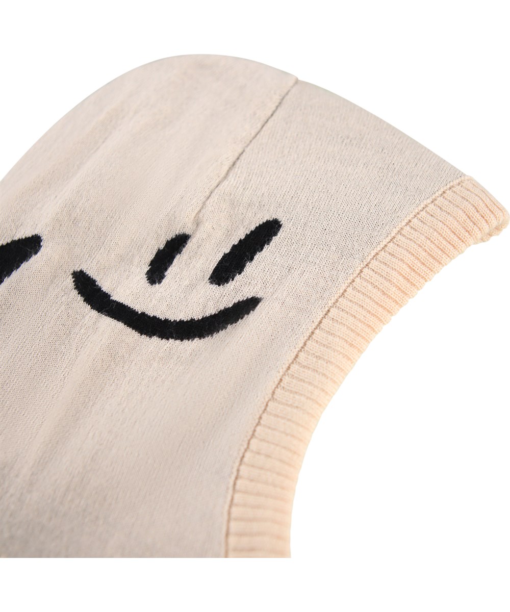 Snow - Vanilla - Cream-colored balaclava for children with black smiling faces.
