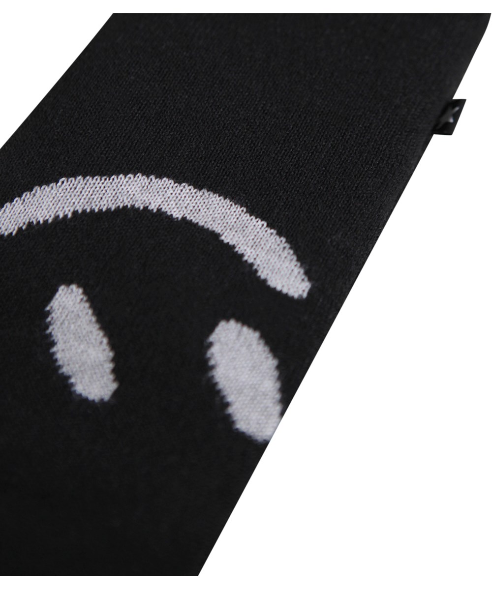 Snowfall - Black - Black mittens with a white smiling face for children.