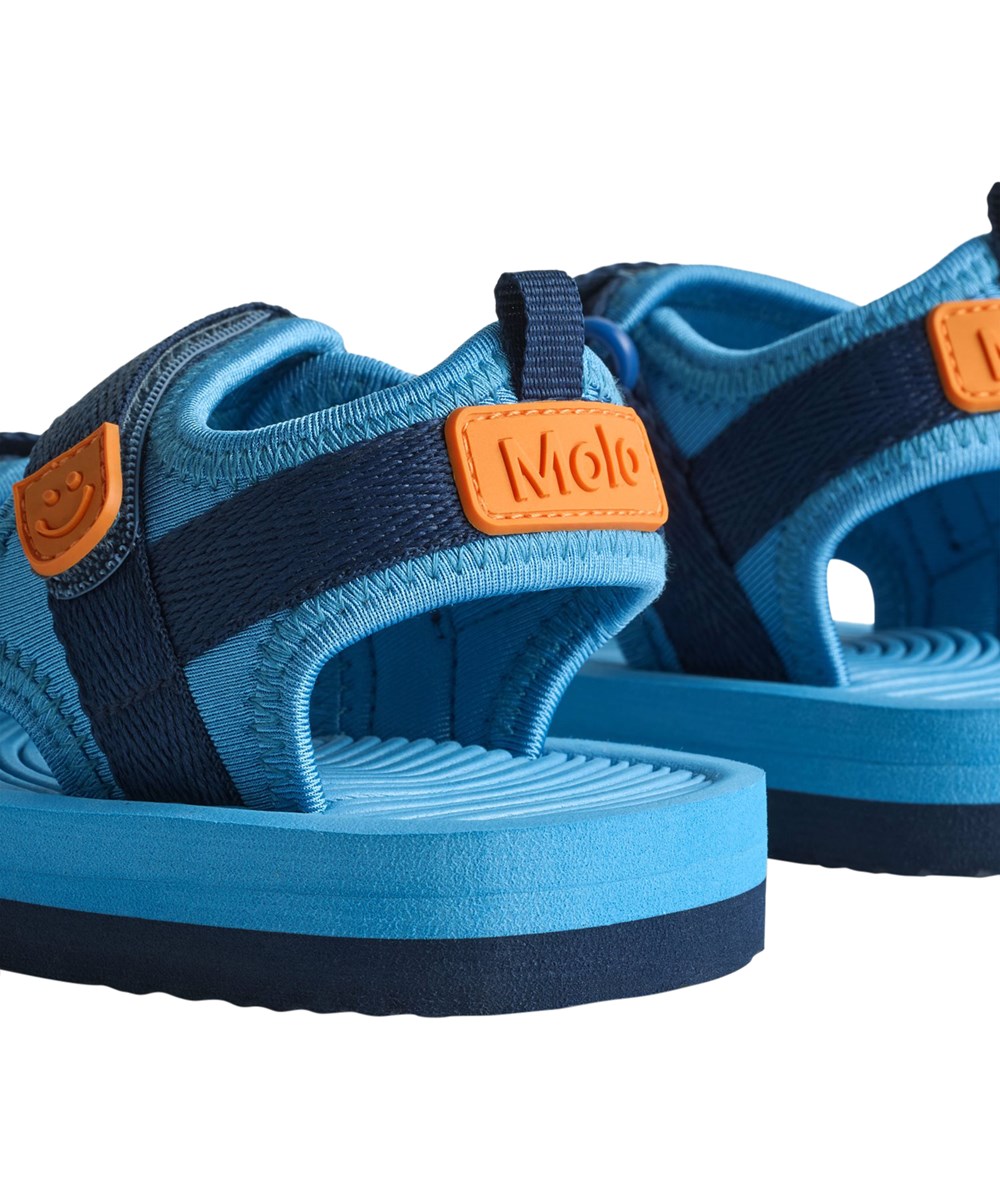 Zola - Blue Tide - Blå, sporty sandaler til børn med blød skumsål og velcrolukning.