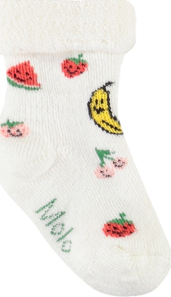 Nodda - Little Banana - 2er-Pack Baby-Socken aus Viskose. Die Socken sind weiß mit Früchten und gelb mit lächelnden Gesichtern.