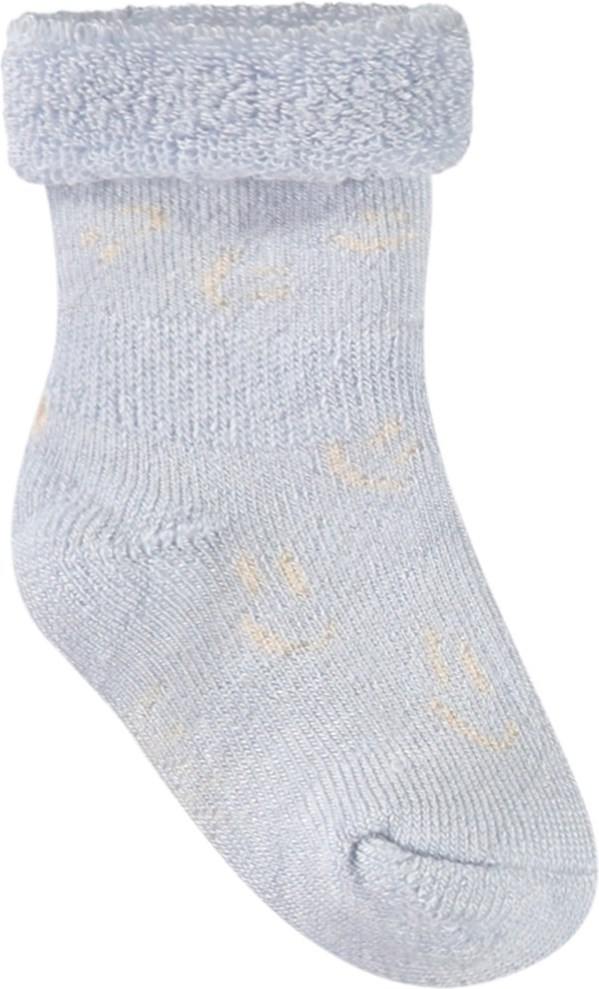 Nodda - Skywriting - 2-pack baby socks in viscose. The socks are white and light blue with smiling faces.