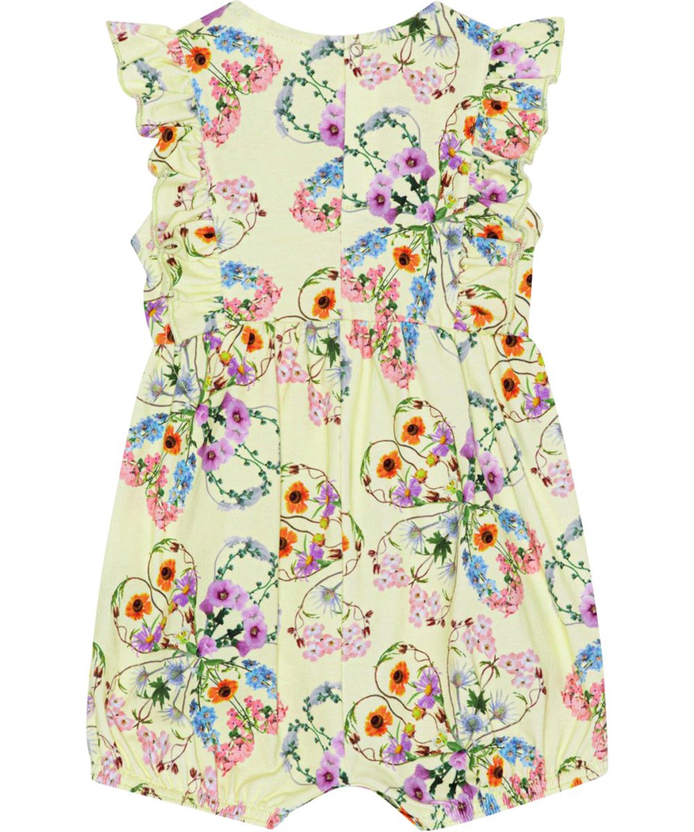 Felicia - Flower Love - Gul Jersey heldräkt med fin volangkant fram- och baktill med färgrika blommor som bildar klöver.