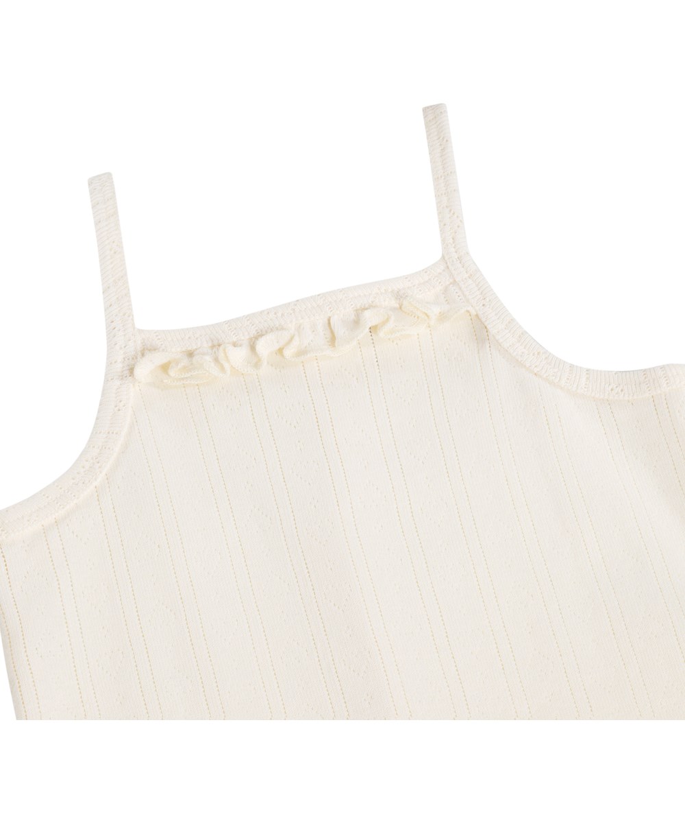 Florie - Pearled Ivory - Vit body för de små i ekologisk bomullspointelle med axelband och volangdetaljer.
