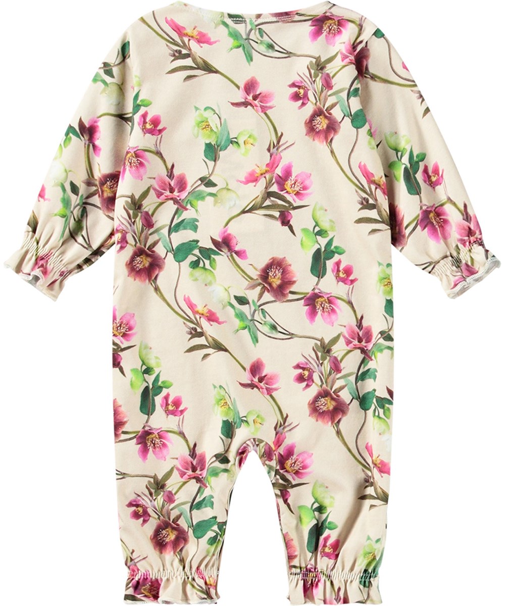 Florina - Hellebore - Beige overall för de små i mjuk ekologisk bomull med blommigt mönster.