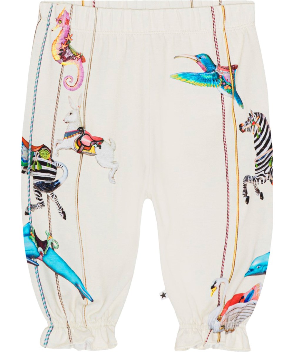 Selena - Carousel Pants - Råvita byxor till baby i ekologisk melerad bomull med färgrika karuselldjur.