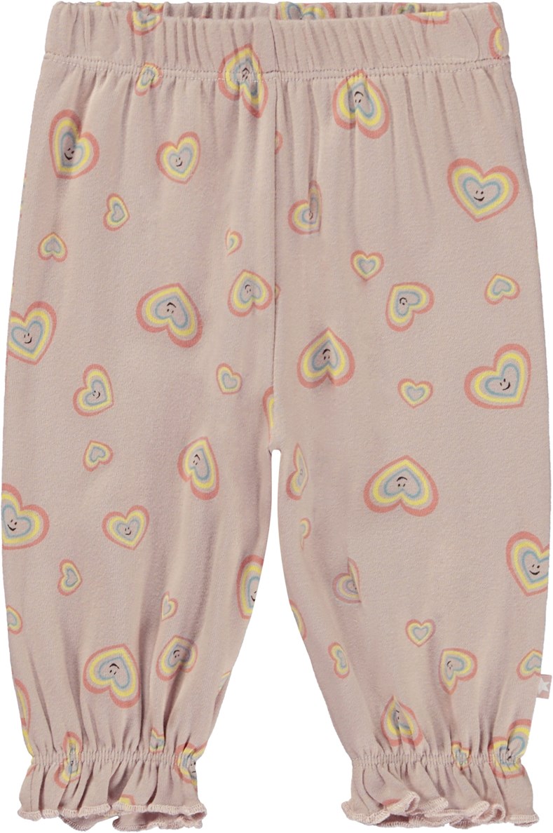 Selena - Mini Aura Hearts - Rosa babybyxor med leende hjärtan.