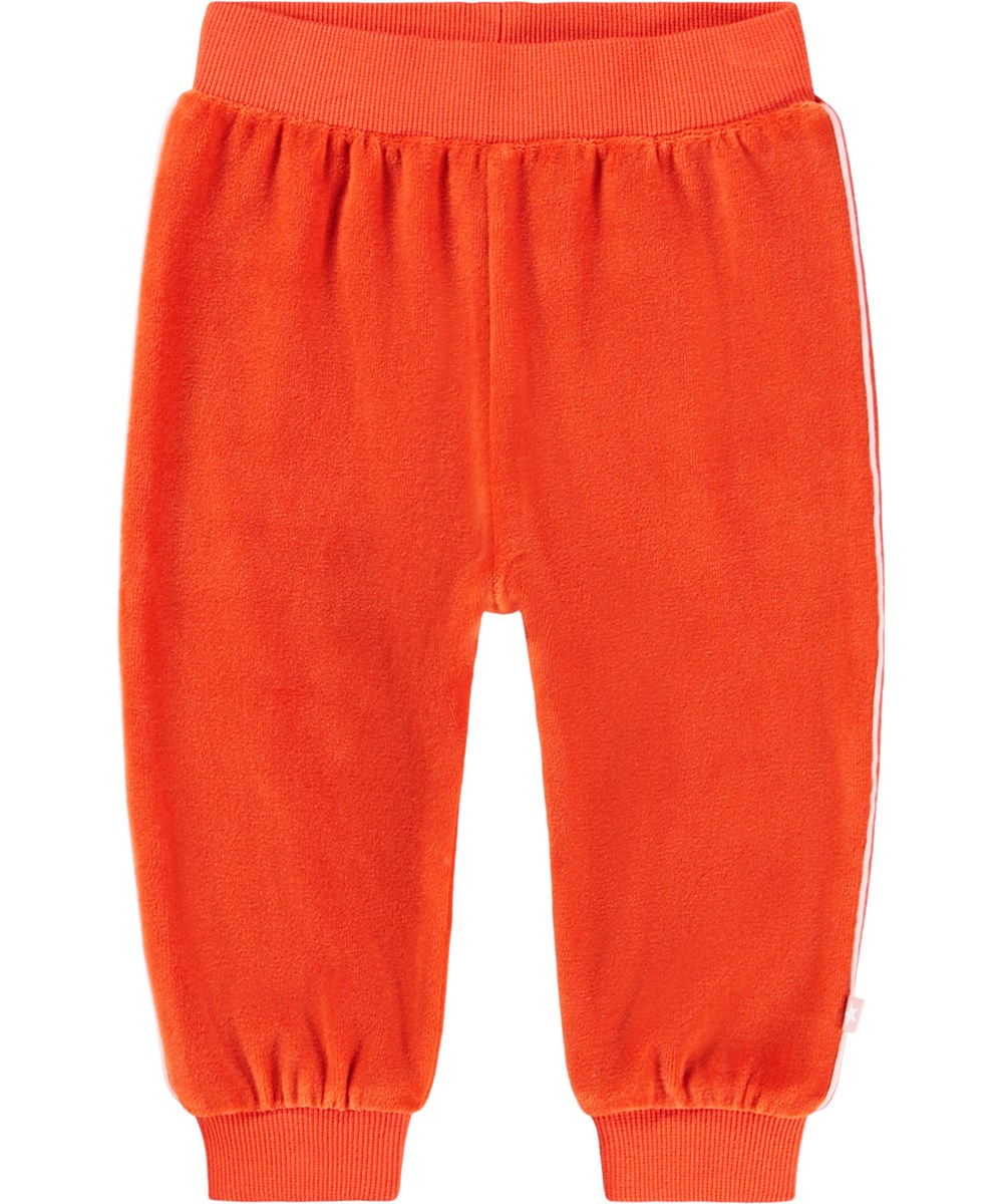 Shona - Rising Sun - Röda byxor till baby i ekologisk velour med orange ton.