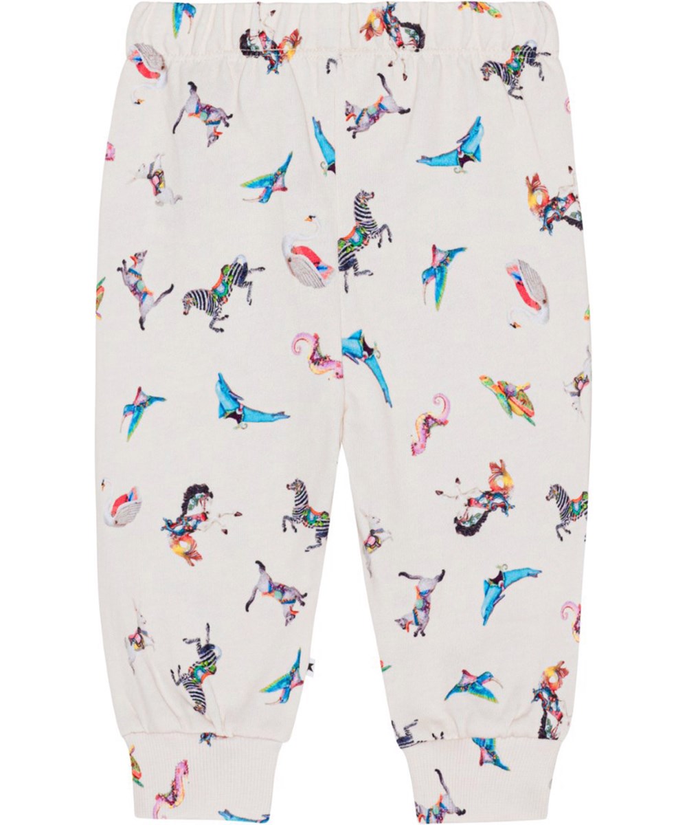 Simeon - Carousel Mini - Råvita sweatpants till baby i ekologisk bomull med karuselldjur.