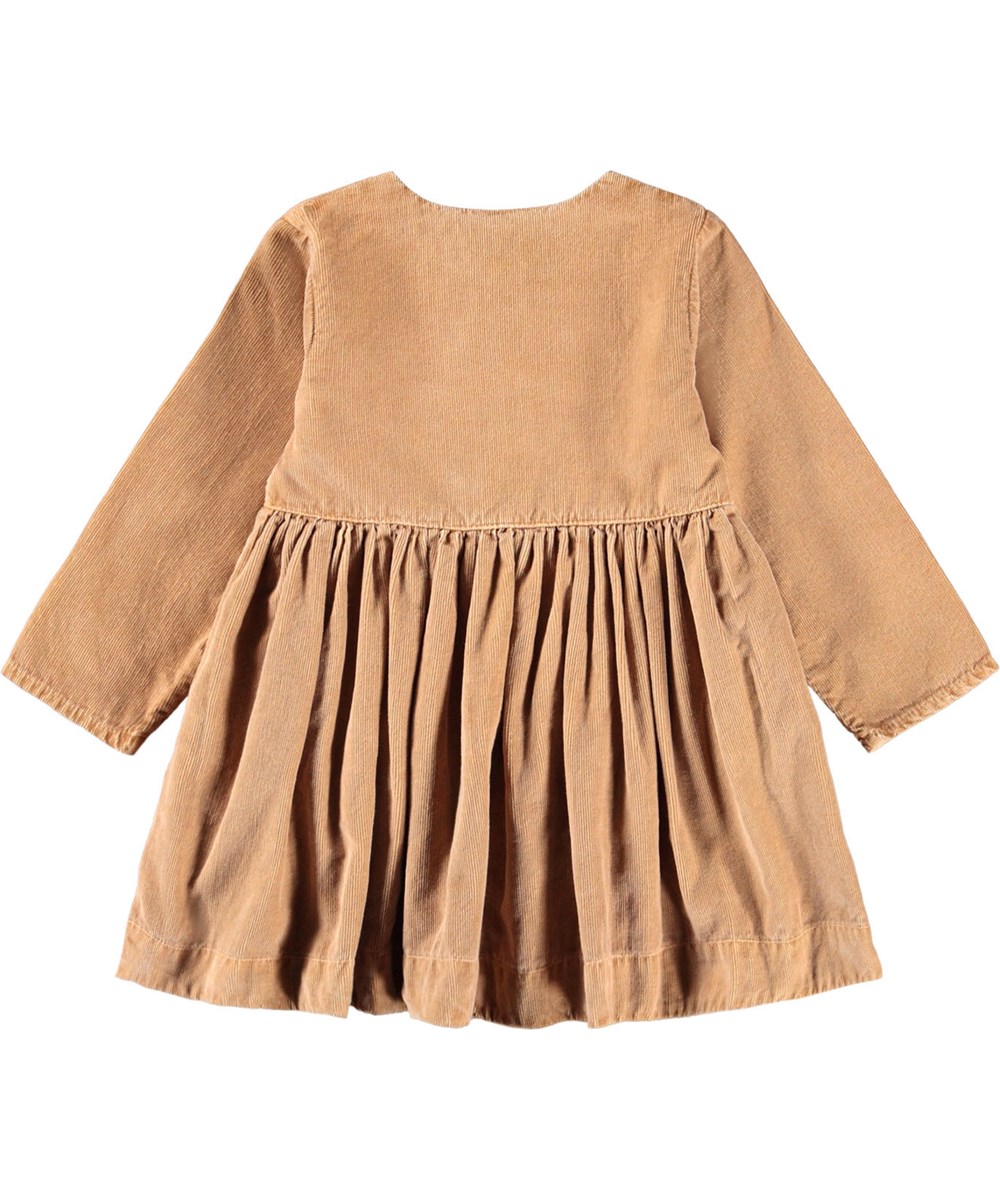 Charlie - Pomeranian - Ljusbrun klänning i mjuk ekologisk bomullscord till baby, med hundfickor.