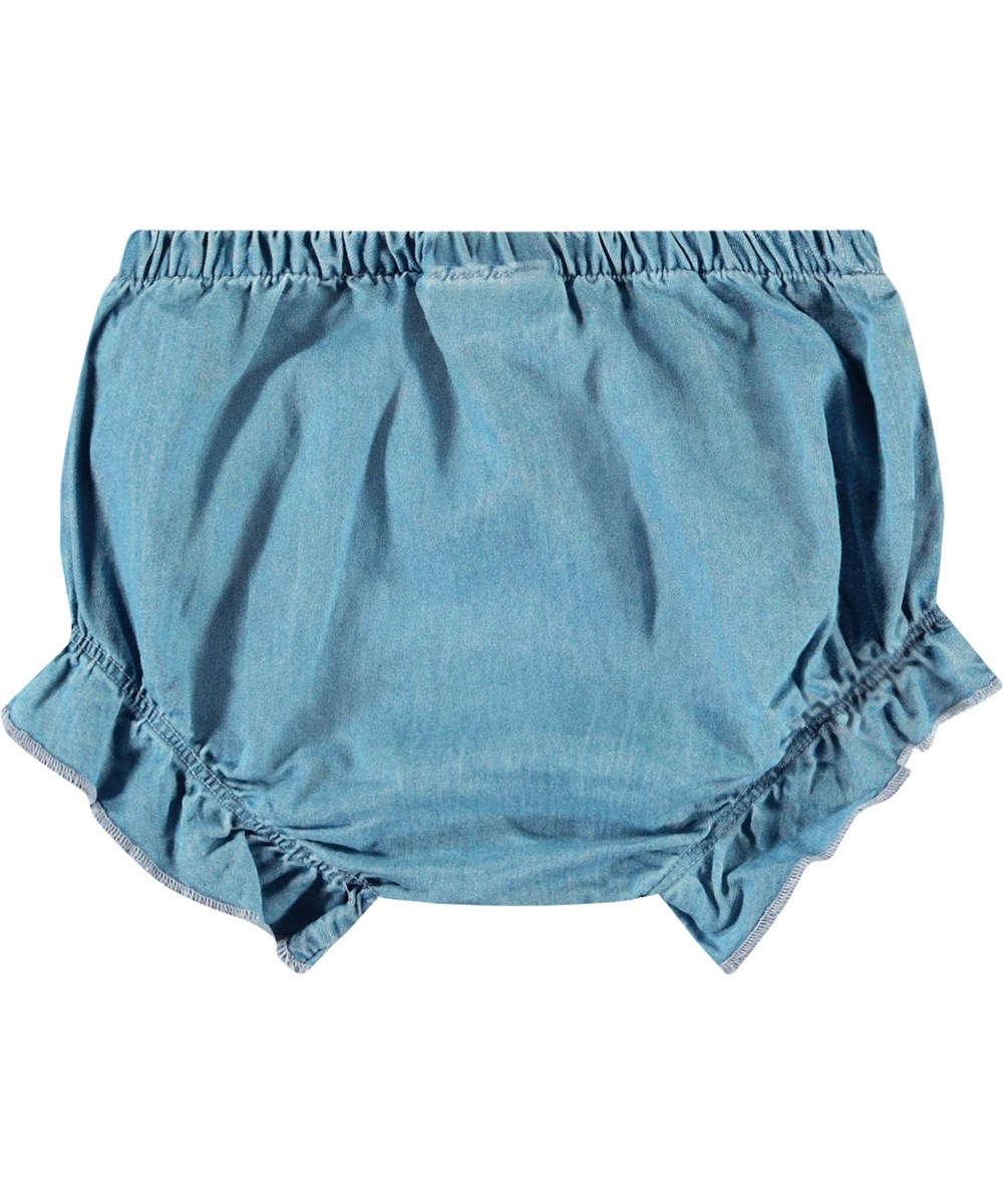 Sadie - Sky Indigo - Ljusblå bloomershorts i ekologisk bomullschambray för baby.