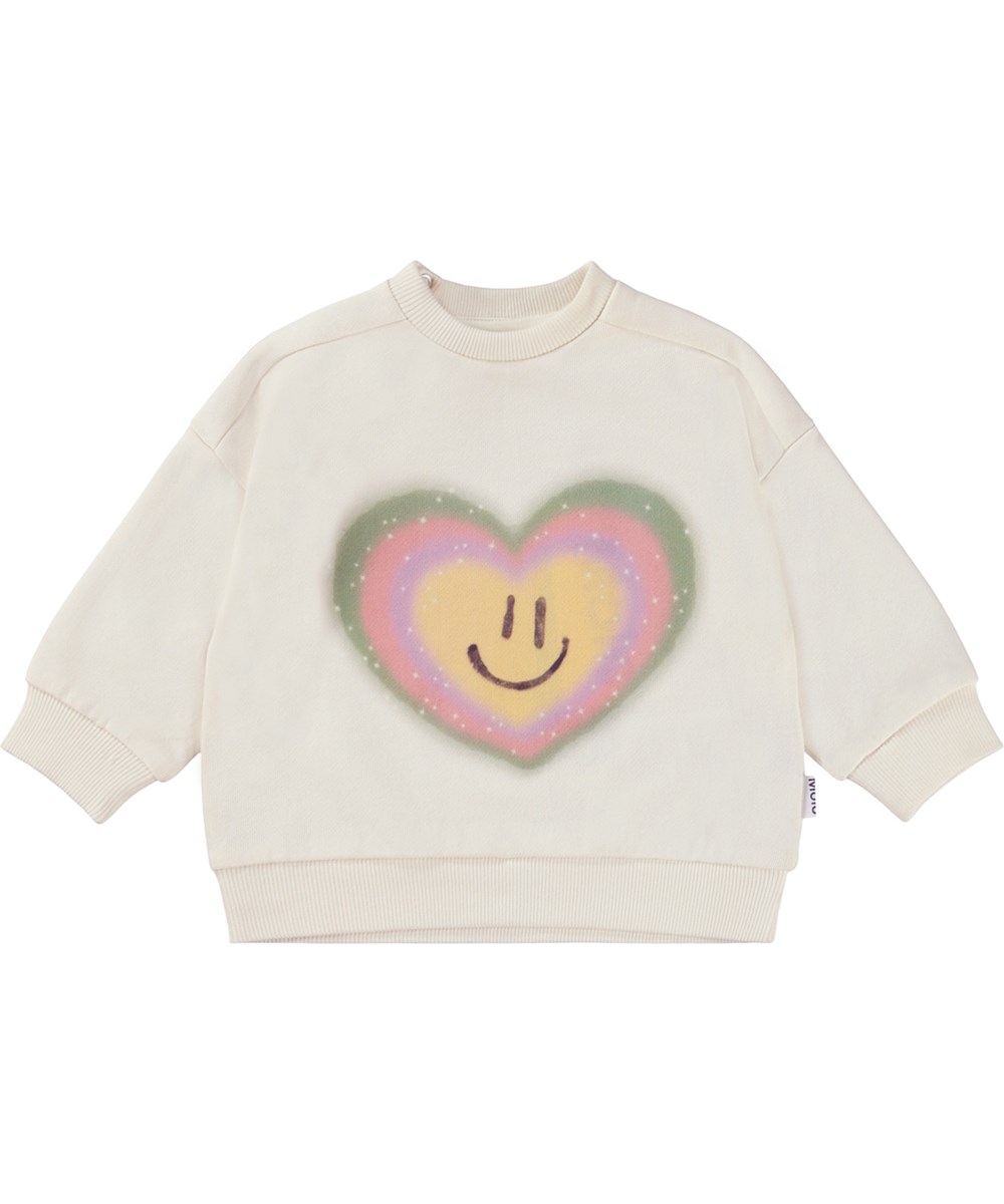 Dana - Pearled Ivory - Ekologisk vit babytröja med leende hjärtan.