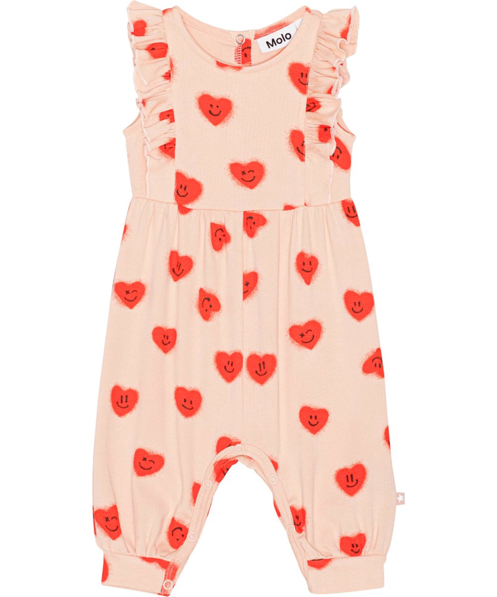 Fallon - Red Hearts_ Jersey - Pink baby romper with a beautiful ruffle edge on the front and back in soft, organic cotton with all over print of sweet, smiling graffiti hearts