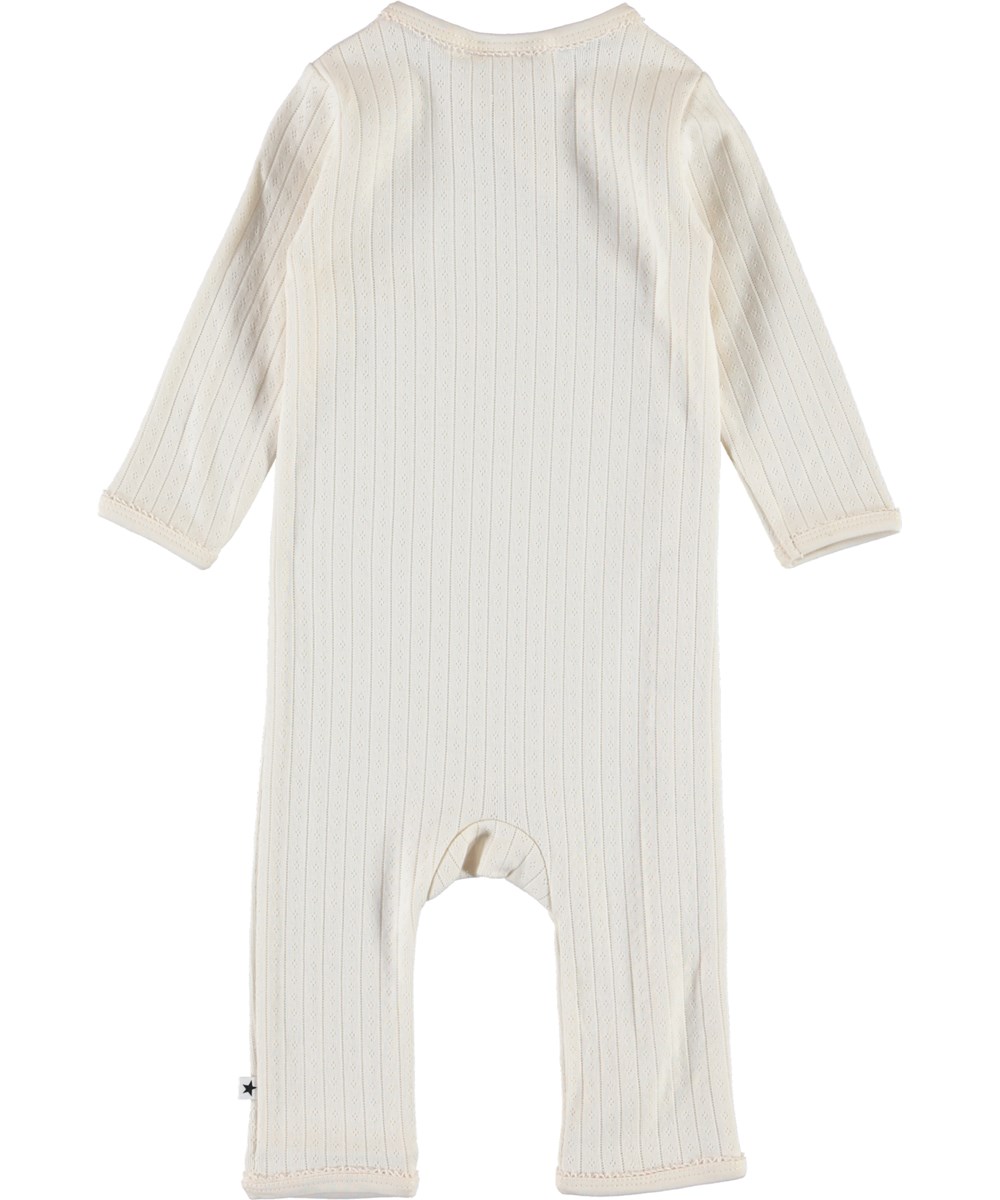 Flora - Pearled Ivory - Organic baby romper in needle-out pattern 
