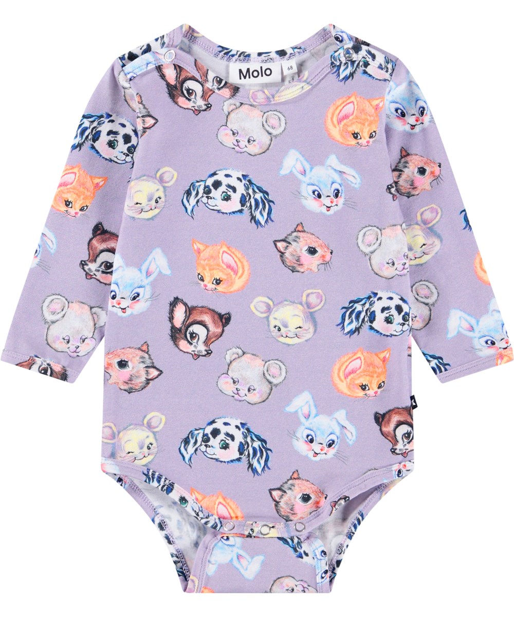 Foss - Itty Bitty - Cream-colored long-sleeved bodysuit for the little ones made of ribbed organic cotton. The bodysuit has a poplin collar, a button closure at the back and snap buttons between the legs for easy dressing.