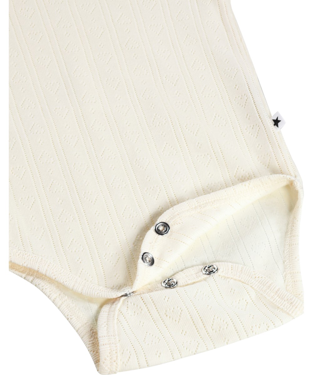 Foss - Pearled Ivory - White, long-sleeved bodysuit for the little ones made of organic cotton pointelle with ruffles