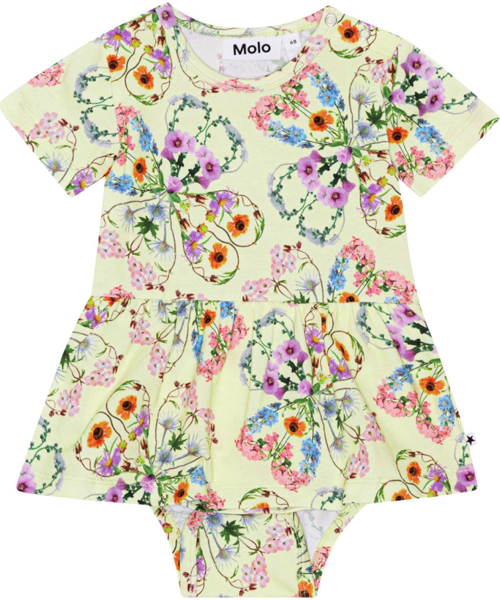 Frannie - Flower Love - Short sleeve, yellow baby bodysuit in stretchy, organic cotton jersey with a print of colourful flowers that form a beautiful silhouette of clovers 
