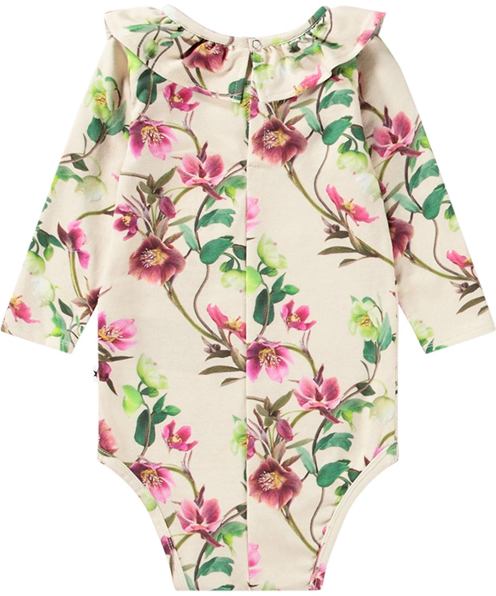 Freya - Hellebore - Beige long-sleeved baby bodysuit made from organic cotton with flower print.