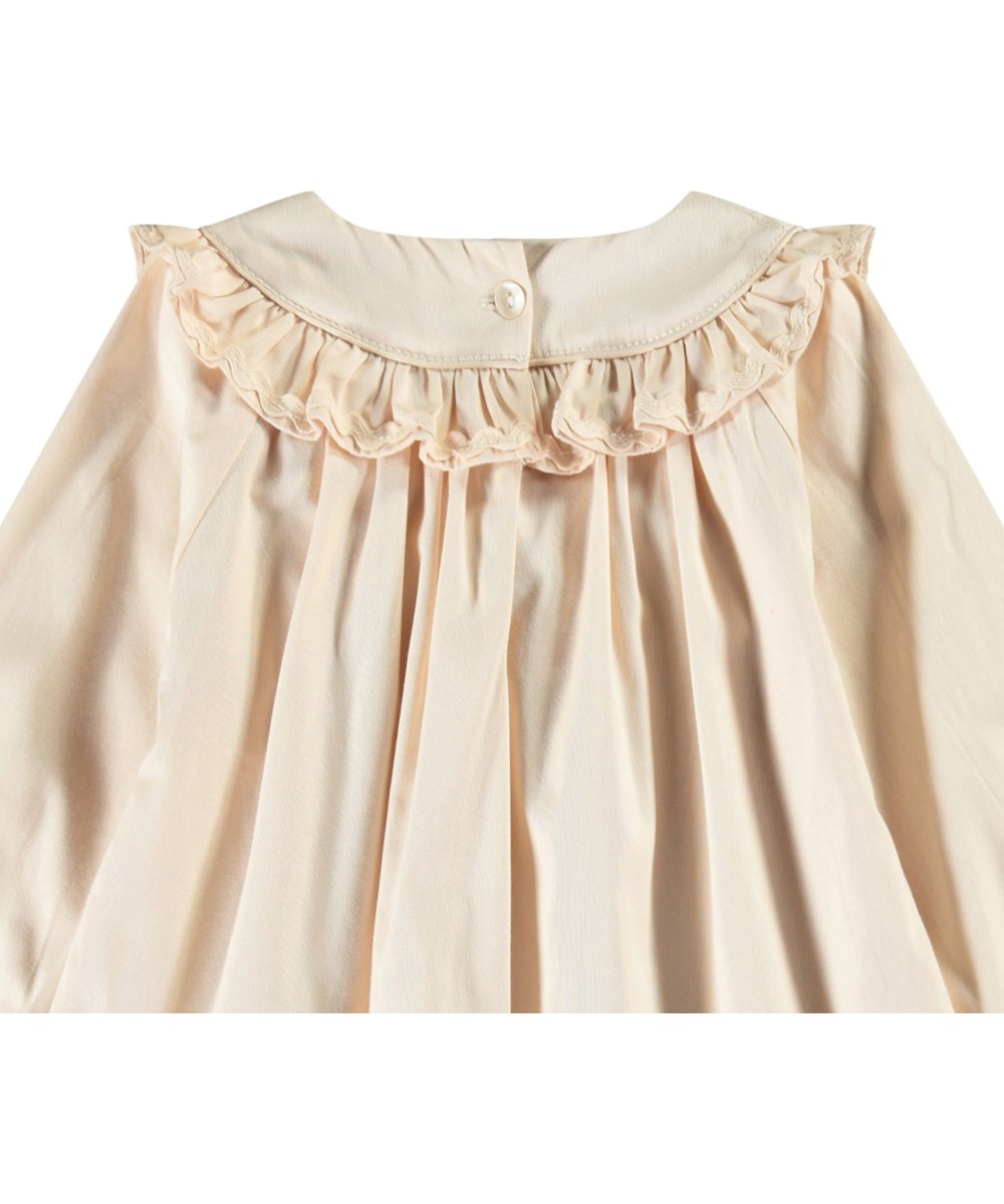 Cailin - Brazilian Sand - Beige baby dress in organic cotton with ruffle details.
