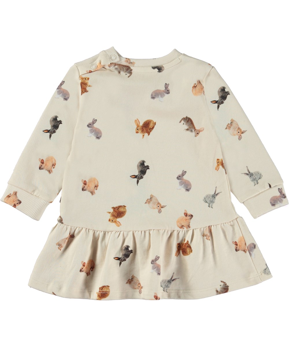 Calypso - Jumping Bunnies - Off-white baby dress with print of small bunnies