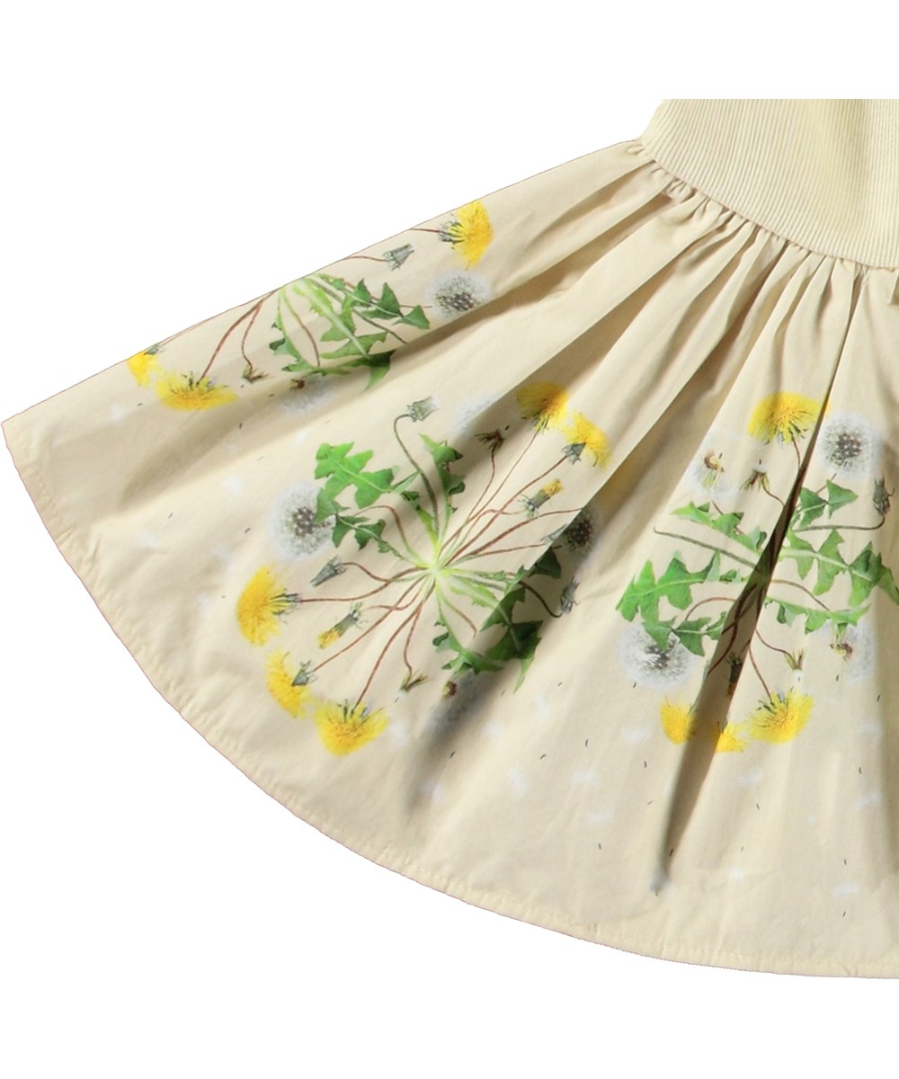 Candi - Baby Dandelion - Long-sleeved dress for baby in organic cotton. The dress is yellow with a dandelion print.