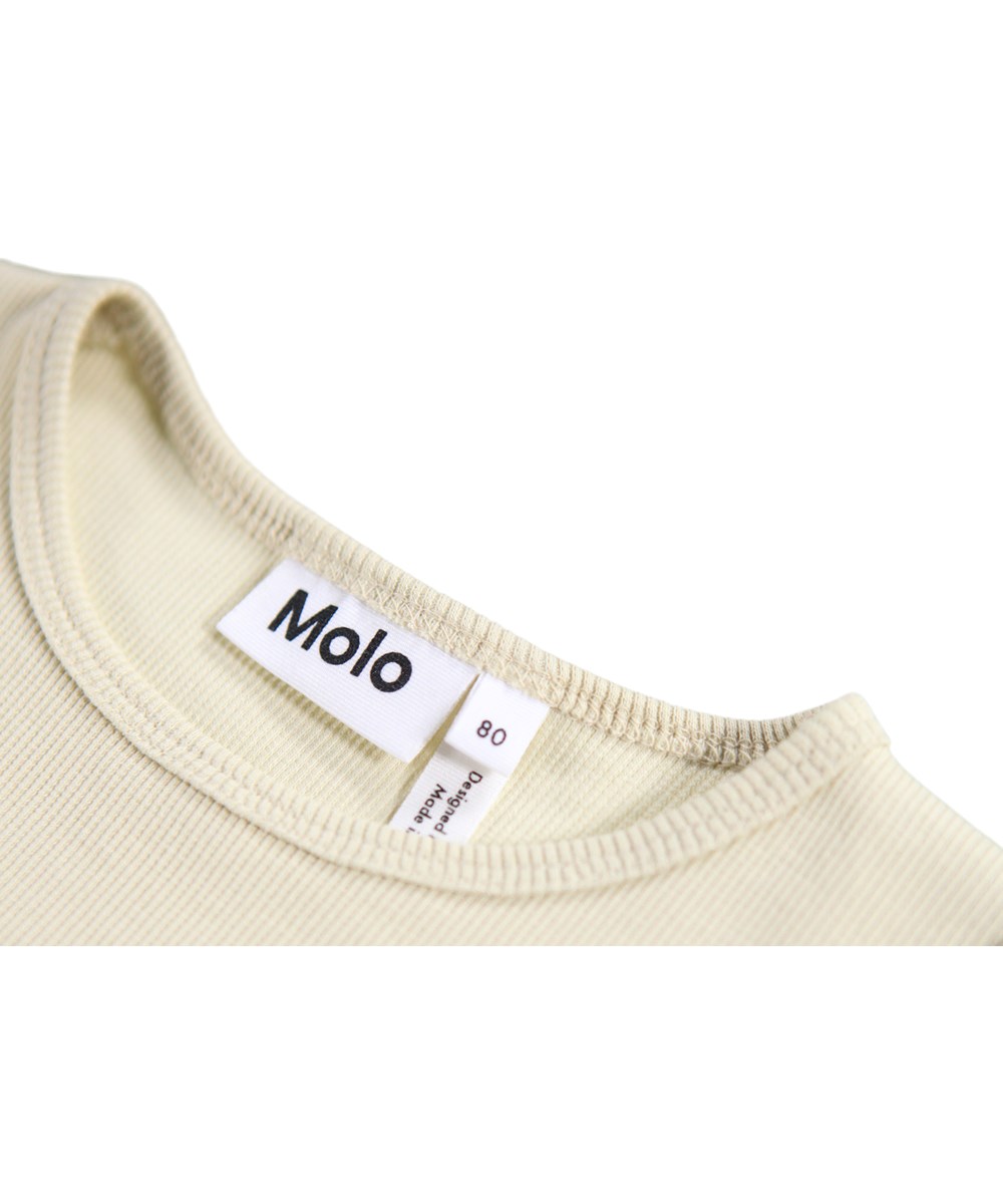 Candi - Floral Heart - Long-sleeved dress for the little ones made of organic cotton. The dress is light green with a print of flowers.