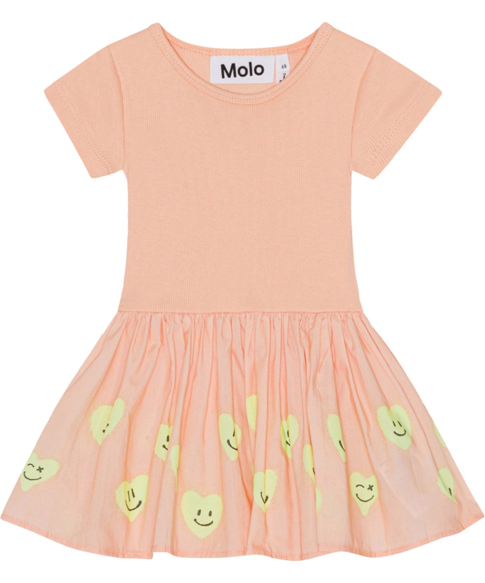 Carin - Line Of Hearts - Peach coloured, organic baby dress with printed skirt 