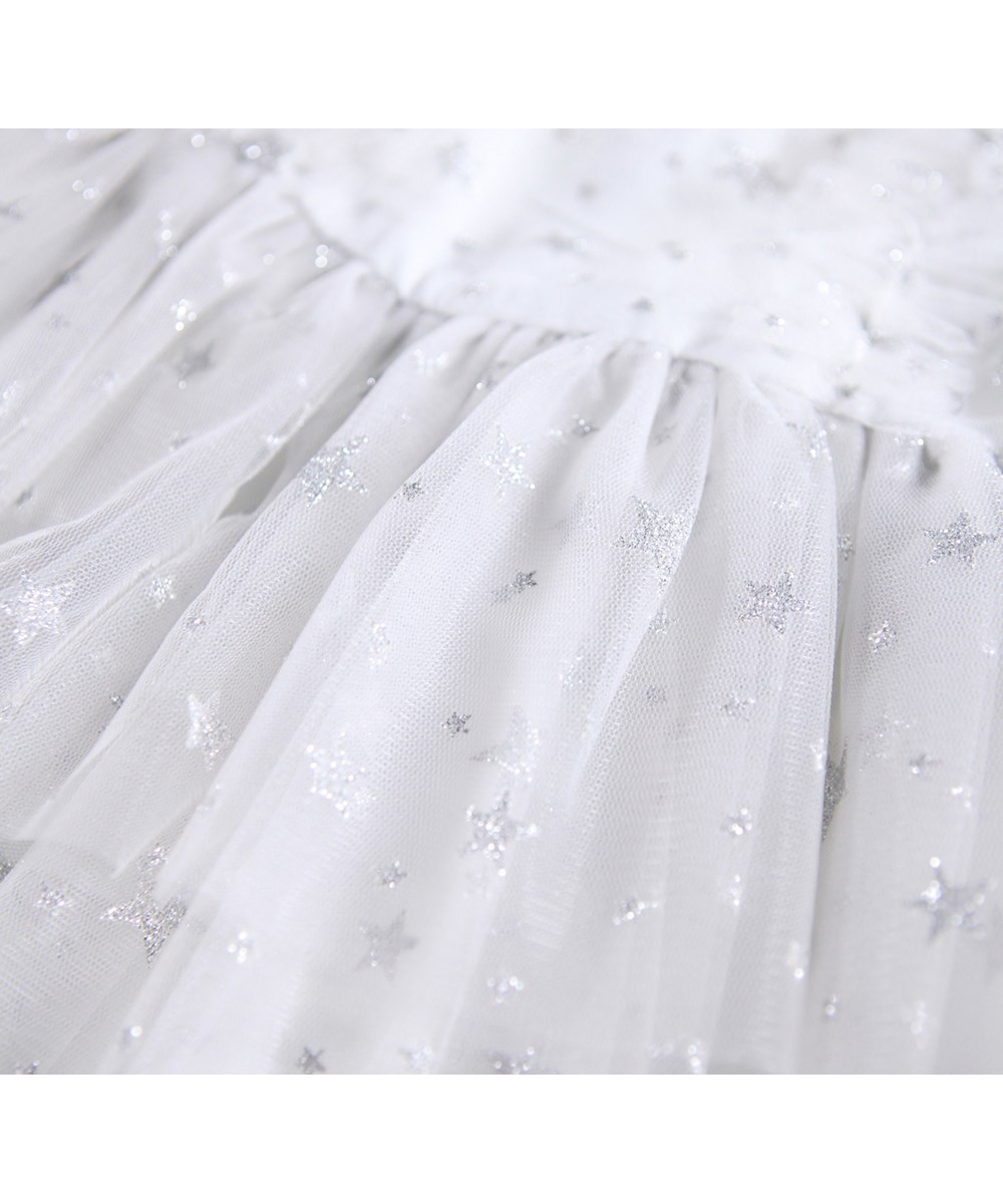 Claudette - Stardust - Festive dress for the little ones made of a fine white tulle with silver glittering stars.