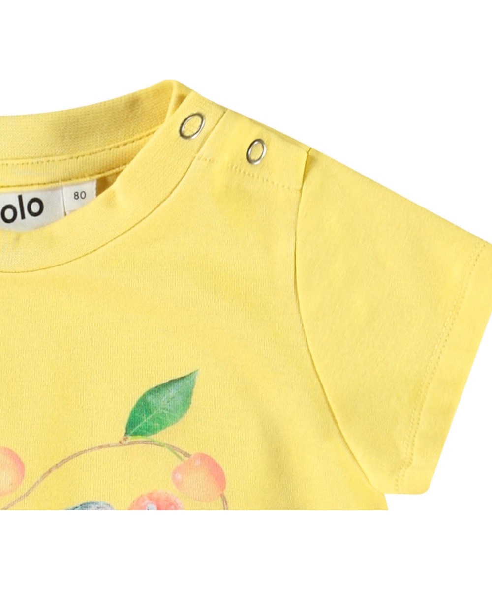 Cosimo - Love Birds Dress - A-line dress in organic cotton for a baby. The dress is yellow with a print of small parrots and cherries.