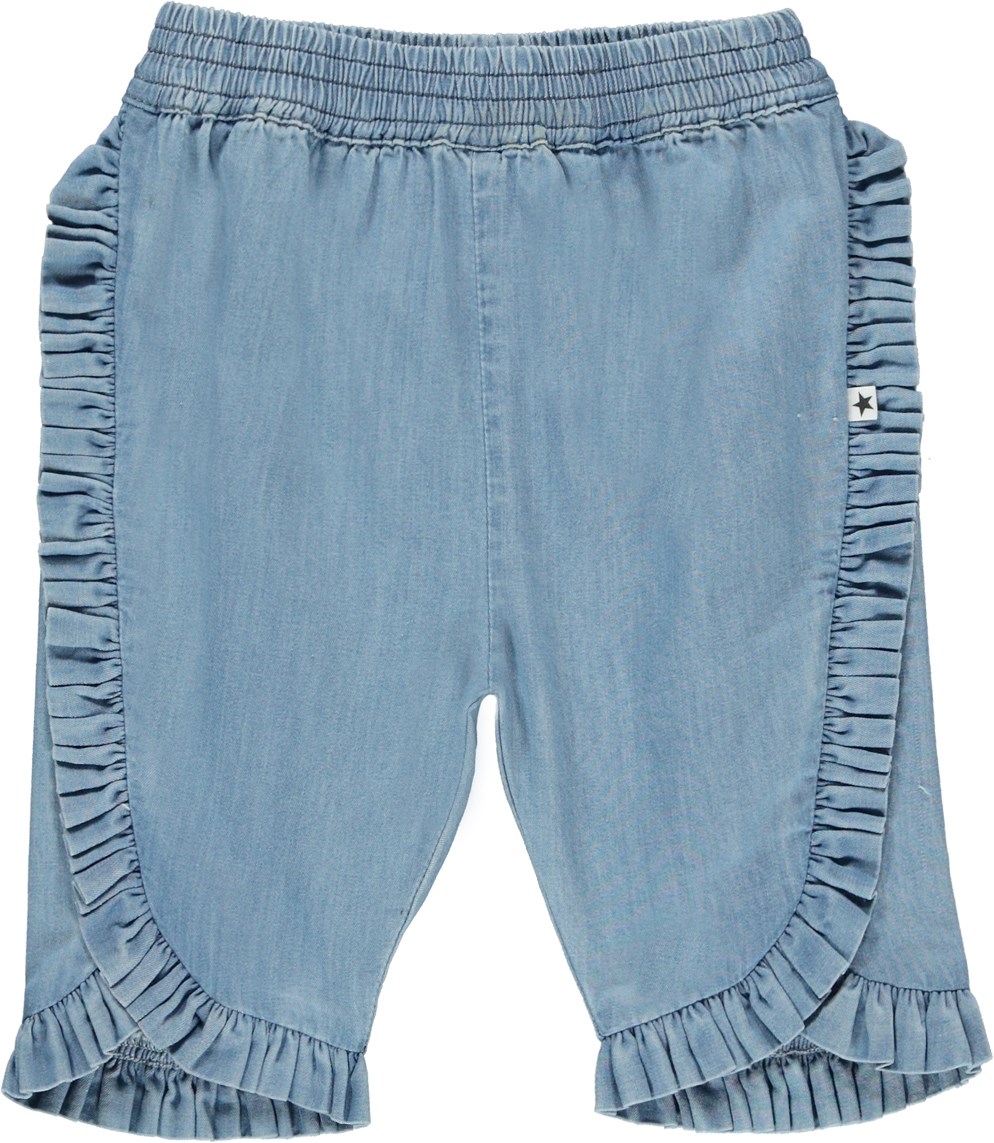 Sallie - Washed Chambrey - Light blue denim baby trousers with ruffle edge 